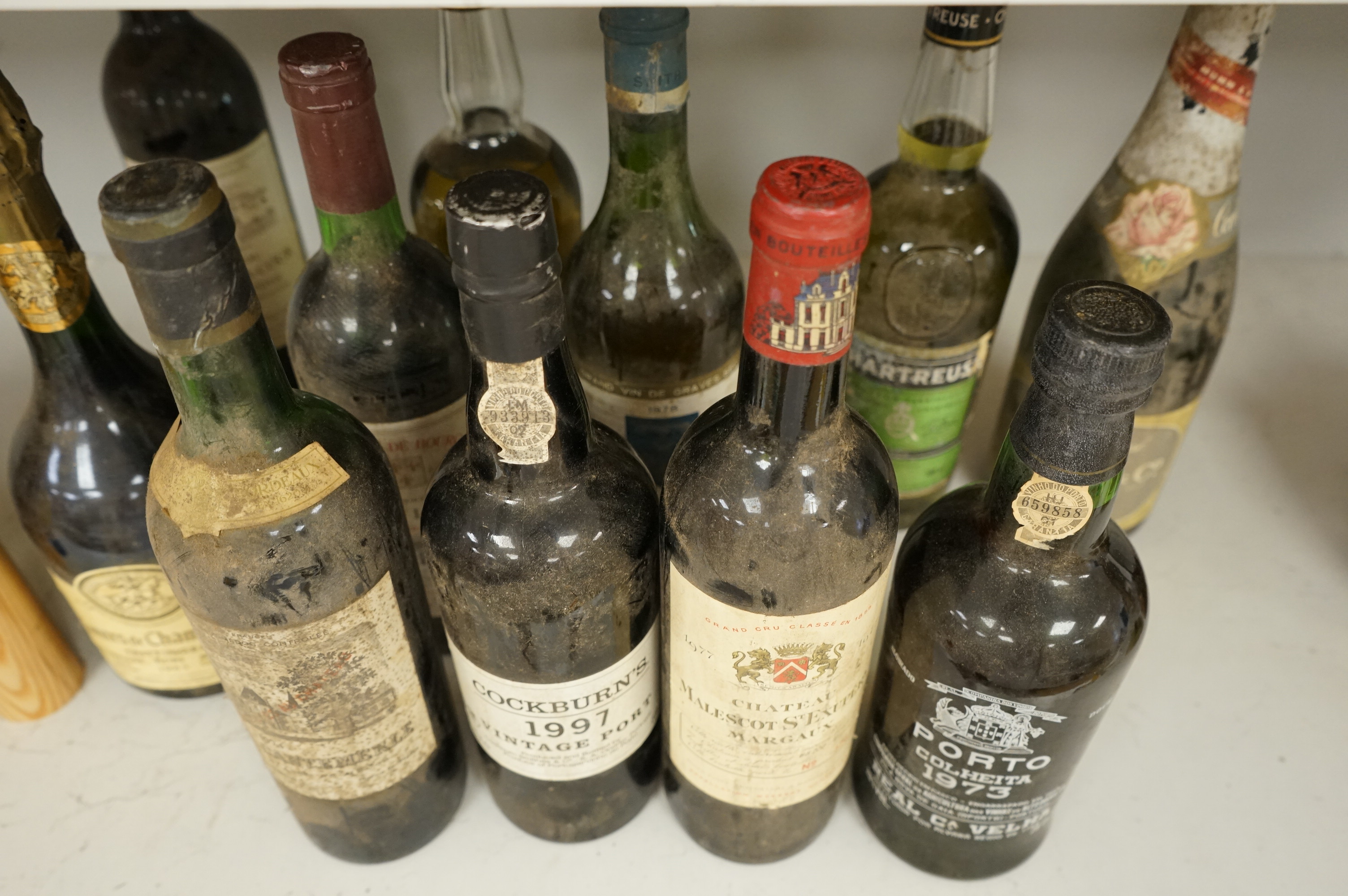 Eleven various bottles of port and wine to include; Cockburns 1997, Chateau Malescot St Exupéry Margaux, etc.